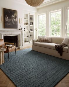 a living room filled with furniture and a fire place