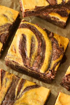 chocolate swirled brownies cut into squares on wax paper