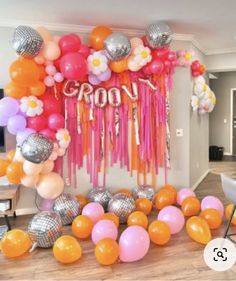 balloons and streamers decorate the entrance to a party