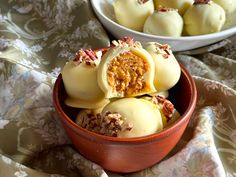 two bowls filled with desserts on top of a floral table cloth next to each other