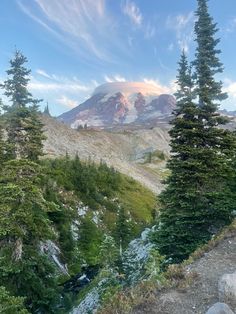 the mountain is surrounded by trees and rocks