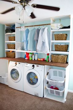 a washer and dryer in a laundry room with baskets on the shelves next to them