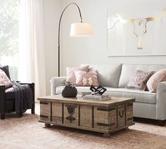 a living room filled with furniture and a lamp