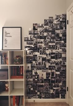 a book shelf in front of a wall with pictures on it and bookshelves