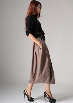 image 5 Elegant Brown Full Skirt Bottoms, Relaxed Fit Solid Color Fall Skirt, Brown Solid Color Skirt For Fall, Fall Pleated Skirt Solid Color Relaxed Fit, Relaxed Fit Solid Color Pleated Skirt For Fall, Fall Pleated Skirt In Solid Color With Relaxed Fit, Chic Fall Maxi Skirt With Pockets, Baggy Solid Skirt For Fall, Brown Flowy Pleated Skirt For Spring