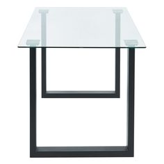 a glass table with black metal legs