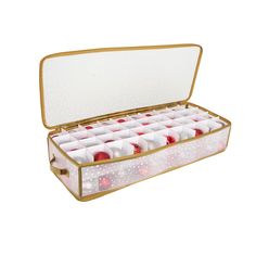 an open box filled with lots of red and white candles