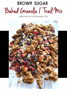 a pile of granola and trail mix on top of a white surface with the words brown sugar baked granola / trail mix