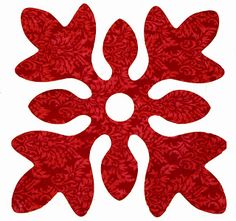 an image of a red flower design on white paper with the center piece cut out