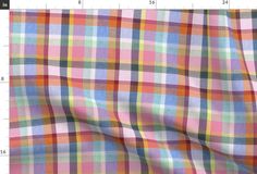 a plaid fabric is shown with measurements for the width and color scheme on it's side