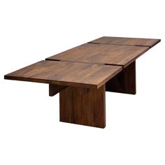 a wooden table with three sections on one end and two ends at the other end