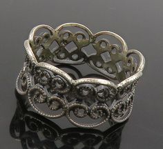 925 Sterling Silver - Vintage Dark Tone Pretzel Knot Band Ring Sz 5 - RG16151  925 Sterling Silver - Vintage Dark Tone Pretzel Knot Band Ring Sz 5 - RG16151  Jewelry Type:         Ring  Metal Type:            925 Silver  Metal Size:             5 Finger  Stone Type:            N/A  Condition:              N/A  Jewelry Weight:     2 Grams  PLEASE NOTE: THIS ITEM IS PRE-OWNED. ALTHOUGH MOST ITEMS ARE IN VERY GOOD CONDITION, SOME MAY NEED CLEANING AND/OR MINOR REPAIRS. WE MAKE A VERY STRONG EFFORT TO UPLOAD CLEAR PICTURES. PLEASE INSPECT ALL PICTURES AND ASK ALL QUESTIONS YOU MAY HAVE PRIOR TO MAKING A PURCHASE. NOT ALL STONES ARE GENUINE, SOME ARE ENHANCED OR CREATED. Adjustable Silver Vintage Filigree Ring, Vintage Silver Open Band Jewelry, Elegant Oxidized Filigree Ring For Anniversary, Vintage Oxidized Filigree Ring For Anniversary, Vintage Filigree Ring With Oxidized Finish For Anniversary, Vintage Silver Filigree Ring With Oxidized Finish, Adjustable Silver Victorian Rings, Victorian Style Silver Metal Rings, Victorian Silver Metal Rings