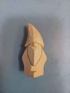 a piece of wood carved to look like a face