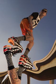 a skateboarder is doing a trick in the air