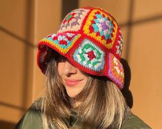 a woman wearing a colorful crocheted hat