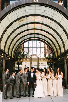 a group of people standing in front of a building