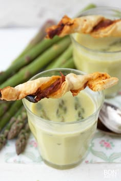 asparagus and bacon appetizers in small cups with spoons