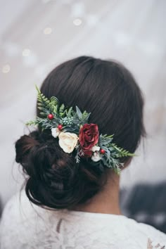 a woman with flowers in her hair is wearing a flower headpiece on her wedding day