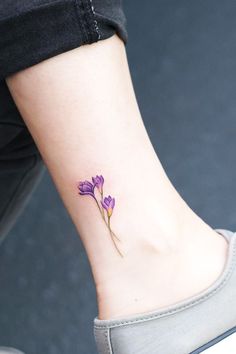 Discover delicate beauty with small flower tattoos. Explore floral ink inspiration for an elegant and meaningful touch. Follow for more tattoo ideas. See more ideas check out here! #smallflowertattoos #flowertattoos #tattooart Crocus Flower Tattoo, Crocus Tattoo, Best Flower Tattoos, Tattoo Mom, Tiny Flower Tattoos, Sakura Tattoo, Bright Tattoos, Chrysanthemum Tattoo, Long Stem Flowers