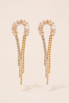 The Vega Half Loop Drop Earrings are the perfect finishing touch to any outfit. The finish adds a touch of glamour, while the rhinestone accents add a touch of sparkle. These earrings are designed with a half loop drop, giving them a unique and eye-catching look. Whether you're dressing up for a special occasion or just looking to add some flair to your everyday look, these earrings are sure to impress. Plus, with their affordable price and trendy design, they make a great gift for any friend or Pearl Shop, Holiday Essentials, Rhinestone Embellishments, Dressing Up, Pearl Set, Gold Rhinestone, Halloween Birthday, Silver Drop Earrings, Gold Drop Earrings