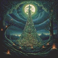 a cross stitch christmas tree with candles in the foreground and a full moon behind it