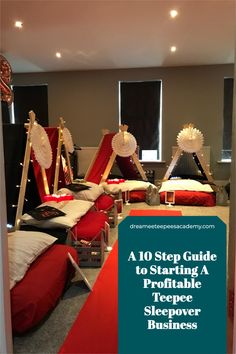 a group of beds with red sheets and white pillows on them, in a room