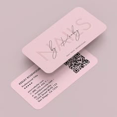 two pink business cards with qr code on them