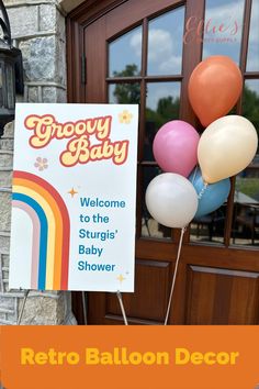 a welcome sign with balloons in front of a door that reads, grooy baby welcome to the stuig's baby shower