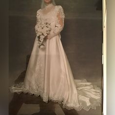 an old photo of a woman in a wedding dress