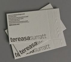 two business cards sitting on top of each other with the words terrasa surrat