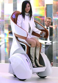 a woman sitting on top of a white scooter in front of a man