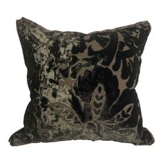 a black and silver pillow with an animal print on it