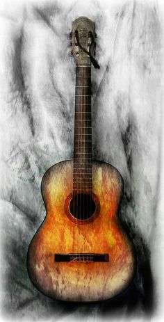 an acoustic guitar is shown in this artistic photo