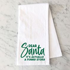 two tea towels with the words dear santa it's actually a funny story on them