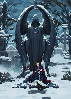 a woman sitting in front of a giant black angel statue on top of snow covered ground