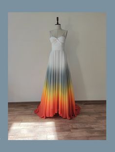 a dress on a mannequin in front of a white wall and wooden floor