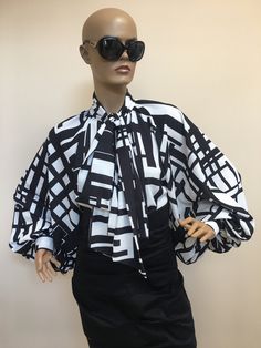 "This is a very stylish Womens Silk blouse. It is comfortable and cozy. Made for a free flowing fit. Great for all year around and for any special occasion or casual day can be dressed up or dressed down. SIZE CHART SIZE S - US 6, UK 8, EU 36 bust: bust around 34.5\"/90cm Waist: waist around 27.5\"/70cm Hips: hips around 34.5\"/90cm SIZE M - US 8, UK 10, EU 38 bust: bust around 37.5\"/95cm Waist: waist around 29.5\"/75cm Hips: hips around 37.5\"/95cm SIZE L - US 10, UK 12, EU 40 bust: bust aroun Trendy Satin Blouse For Spring, Trendy Satin Blouse For Fall, Chic Silk Shirt For Fall, Designer Shirt For Spring Party, Designer Shirt For Party In Spring, Designer Spring Party Shirt, Designer Party Shirt For Spring, Modern Summer Evening Blouse, Black Silk Tops With Blouson Sleeves