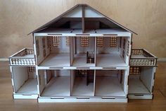 a doll house with all the windows missing