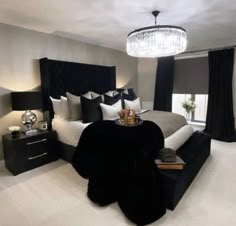 a bedroom with black and white decor in it