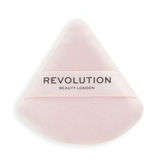 Create the ultimate flawless base with the Revolution Beauty IRL Soft Focus Powder Puff, a triangle-shaped makeup powder puff.  Designed for applying loose or pressed powders, the IRL puff presses pigment onto the face for a smooth, blurring effect. The triangle shape of the powder puff delivers precise application, helping to get into hard-to-reach areas such as the inner corners of the eyes. Decorated with a ribbon handle, the puff allows a firm grip to ensure accuracy when layering on your po Eye Corner, Flawless Base, Urban Decay All Nighter, Buy Makeup, Blur Effect, Makeup Powder, Flawless Foundation, Makeup To Buy, The Triangle