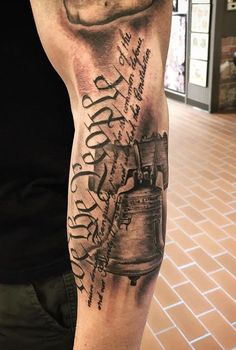 a man with a tattoo on his arm