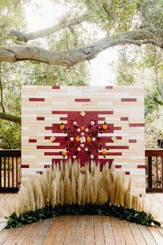 an outdoor ceremony setup with pamodia and grass