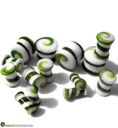 green and white striped glass beads with swirls on the ends, set of 10