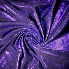 the purple fabric is very shiny and it looks like something out of an old movie