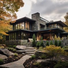 a modern house with stone steps leading up to it