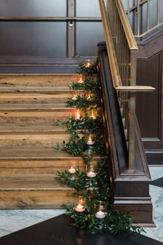 candles are lined up on the stairs