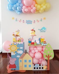 a birthday party with balloons, cake and decorations