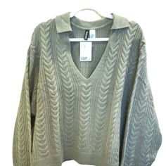 Nwt. Adorable V-Neck Cable Knit Sweater With Collar. Solid Color In Khaki Green. Ribbed Sleeves And Hem. Dropped Shoulders. Regular Length. Fit: Relaxed Fit Content: 100% Acrylic This Sweater Was Only On A Hanger For Photo Purposes Only. This Item Comes From A Smoke Free Home Same Or Next Day Shipping Except On Sundays And Holidays Thank You For Looking!!! H&m Knit V-neck Top, H&m Knit Tops For Fall, Oversized H&m Winter Tops, Fall Knit Tops By H&m, Cozy Cable Knit V-neck Top, Cozy H&m Tops For Fall, H&m Cozy Knit Tops, Cozy Knit Tops By H&m, Green Cable Knit V-neck Sweater