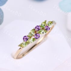 You are looking at a natural peridot and natural amethyst wedding ring.Vintage peridot wedding band,14k gold ring,cluster marquise peridot amethyst ring,August birthstone ring,stacking band,gift for women,Christmas gift You can choose the other side stone as you like: Alexandrite: www.etsy.com/listing/1506185634/vintage-peridot-wedding-band18k-solid? natural pearl: www.etsy.com/listing/1539377258/vintage-natural-peridot-pearl-wedding? Diamond/Moissanite: www.etsy.com/listing/1340984722/vintage-peridot-wedding-band14k-solid? Stone: *4x2mm marquise shaped natural peridot *2mm round cut natural amethyst. Metal *925 sterling silver  * Solid 10k 14k &18k. *Color:white gold,yellow gold,rose gold. Platinum Custom Order *The main stone can be other gemstones you can imagine,any birthstone can be m Peridot And Amethyst Ring, Amethyst And Peridot Ring, Peridot And Opal Ring, Peridot Wedding Band, Peridot Wedding Ring, Peridot Ring Gold, Amethyst Wedding Ring, Peridot Rings, Amethyst And Peridot