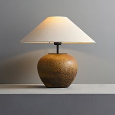 Inspired by the timeless elegance of vintage ceramics and the warm tones of rural landscapes. The lamp's base showcases the charm of handmade ceramics, creating a cozy and welcoming atmosphere. Light Source One 40 watt maximum medium (E26 or E27) bulb required. (Not included bulbs) Dimmable with compatible dimming bulbs. Measurements Diameter: 15.7" Height: 15" Base diameter: 8.7" Base height: 7.1" Plug Cord On/Off Switch: 59" Features Material: Ceramic, Fabric, Iron. Beige lampshade. The cerami Brass Living Room, Jar Table Lamp, Modern Desk Lamp, Lampshade Designs, Wabi Sabi Style, Ceramic Texture, Pottery Jar, Wood Floor Lamp, Kitchen Ceiling Lights